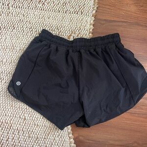Size 6 Black Lululemon Hotty hot shorts, 4 inch inseam